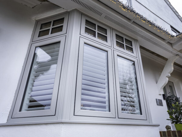 Close-up of flush uPVC casement window with slim sash set level within the outer frame
