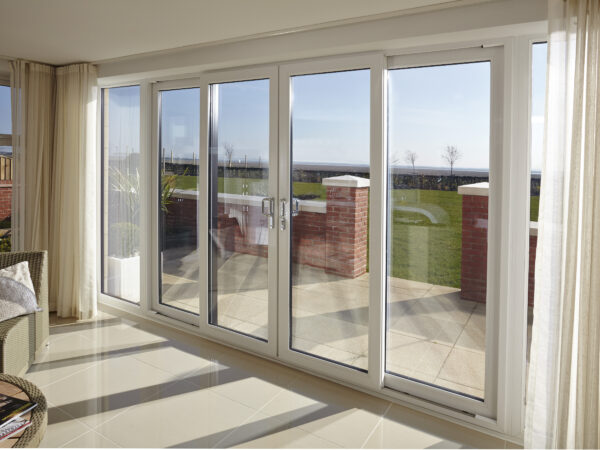 Sliding patio doors leading to patio area with natural light flooding room