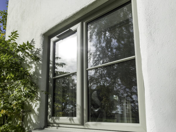 Installed uPVC casement window set in a rendered wall