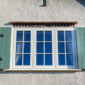 Flush casement windows on a traditional cottage-style house with authentic timber appearance