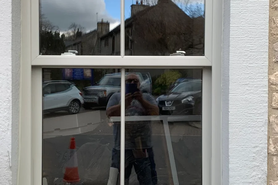 ewly installed uPVC vertical sliding sash windows on a residential property in Northamptonshire