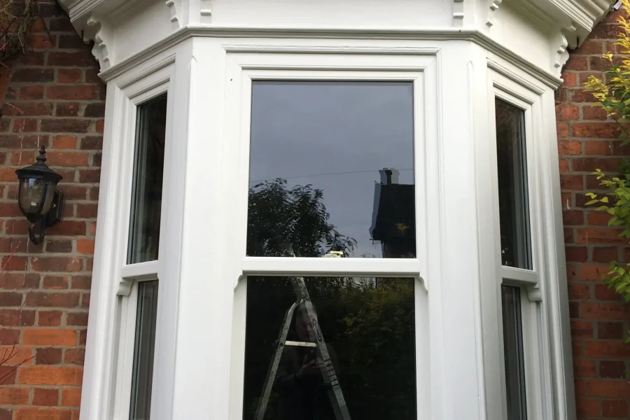 Bay window with restored uPVC vertical sliding sash windows in Walton near Lutterworth